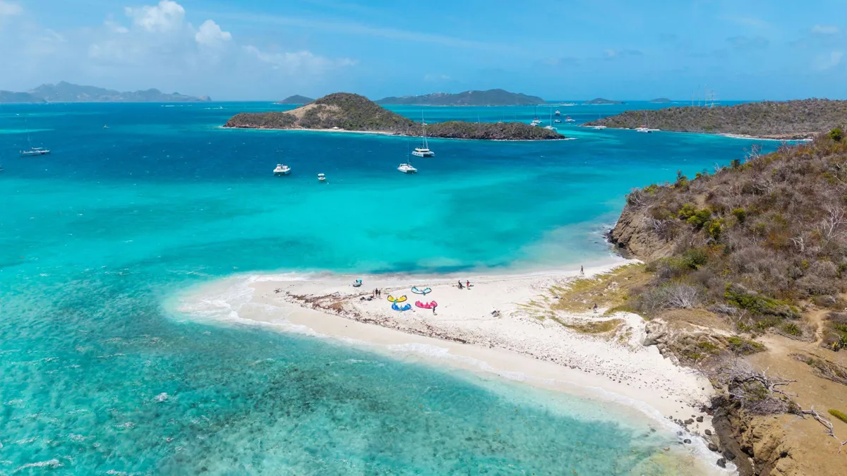 Catamarans anchored beside a Grenadines sandbar