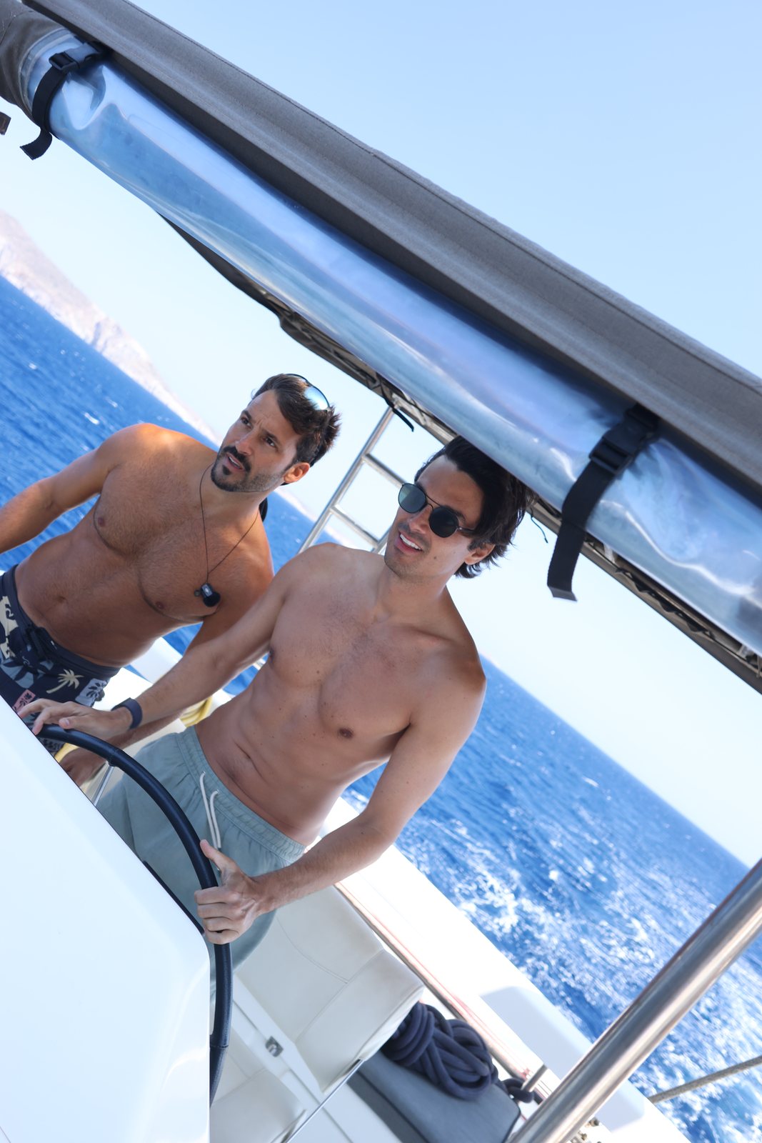 Two guests at the helm under way